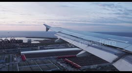 smooth landing of airplane at barcelona airport shot from the window