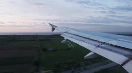 smooth landing of airplane at barcelona airport shot from the window