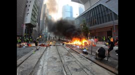 Hong Kong protesters set large barricade fire Wan Chai