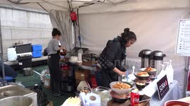 Japan Matsuri 2019 visitors enjoy Japanese cuisine at food and drink stalls in Trafalgar Square - London