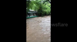River in Mexico floods from Tropical Storm Narda