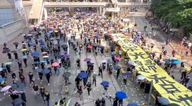 Hong Kong protesters chant “Five demands, not one less” during protest in Wan Chai