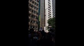 Hong Kong protesters release black balloons