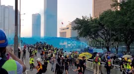 China national day: Hong Kong police spray protesters with blue-dye water cannons outside central government offices