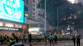 Moment protesters in Hong Kong throw petrol bombs towards police