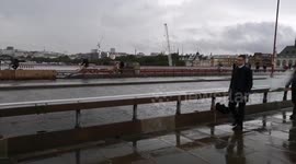 Londoners brave the rain