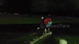 Man rides skimboard in flooded field in Canada