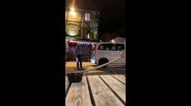Drunk man vandalises taxi and argues with bouncers on the street in Brighton