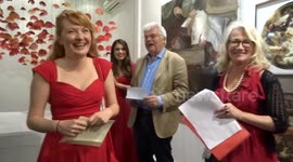 Canadian artist Amanda McCavour accepts award for her Poppies installation at La Galleria