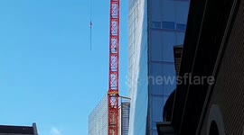 Emergency services make their way up crane by The Shard as man continues to climb