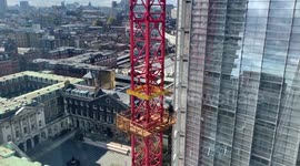 Man climbs crane next to Shard