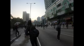 Protesters pull back in Wong Tai Sin, under a rain of tear gas