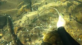 US boyfriend and girlfriend find stolen laptop, printer, sledge hammers, and more underwater in river while hunting lost valuables and treasure!