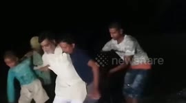 Hilarious moment politician falls off makeshift boat while posing for picture in northern India