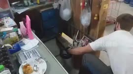 Grocery shop owner in Thailand finds king cobra hiding among shelves