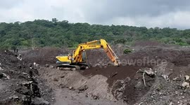 Guatemala excavating for more than 100 missing bodies from last year's volcanic eruption