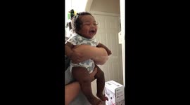 Four month old baby laughing