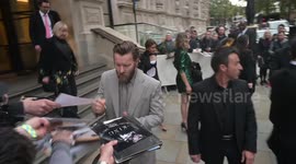 Joel Egerton and then directorDavid Michod sign for fans when leaving to attend the premiere of THE KING at the 63rd London Film Festival