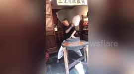 Hilarious scene as Chinese man performs spicy dance routine while grinding chillis