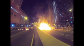 Fireman extinguish a huge blaze lit up by protesters in Wong Tai Sin