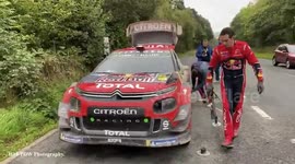 Mechanics work on cars in Wales during World Rally Championship