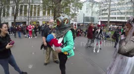 Baby Is Confused When Its Mother Puts On An Amazing Zombie Head During The World Zombie Day In London
