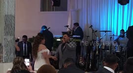 Father composes and sings to his daughter in her wedding