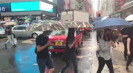 Thousands of protesters take to the streets of Hong Kong to protest against face mask ban