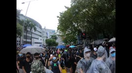 Protesters sing “Glory to Hong Kong” On the street in front of Festival Walk