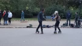 Cool dance moves by roller skaters to music in Hyde Park - London
