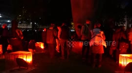 Rebel camp of the climate change activists lit up in red on the Opening Night of two-week London protests