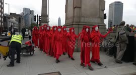 Lambeth Bridge closed as Extinction Rebellion protesters dressed in red robes patrol London
