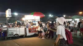 Customer catches ice cream scoop thrown from 30 feet away by 'Flying Ice Cream' vendor
