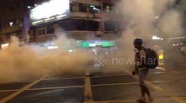 Hong Kong police fire tear gas at civilians at main road in Mong Kog