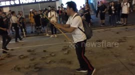 Hong Kong protesters launch attack on 'pro-China' man wielding a bamboo stick