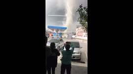 Terrified staff and customers run for cover as tornado rips through petrol station in Thailand