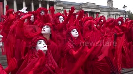Red Brigade panto on the steps of Trafalgar Square on day one of Extinction Rebellion climate change protests in London - October 2019