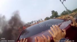 Hero highway cops in China shove BURNING car off road - to prevent traffic jam