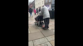 Adorable elderly couple cruise together on electric wheelchair hover-board hack