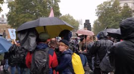 Extinction Rebellion London protesters dancing in the rain