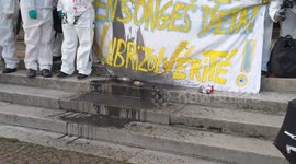 French activists drop 'contaminated' water vials to protest American chemical plant following fire