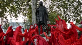 Dramatic scenes as Extinction Rebellion's Red Brigade pay tribute to Gandhi and Mandela