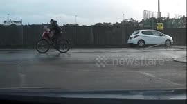 Brazen Brit Biker with baby on Handle bars