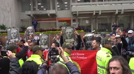Supporters and opponents of Former Colombian president face off outside court in Bogota