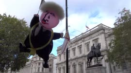 Broadcasting Boris Johnson blimp joins Extinction Rebellion camp in Whitehall as climate change protests continue in the capital - London