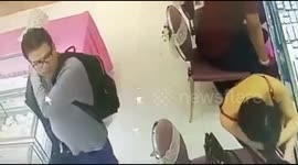 Man steals woman's handbag while she shops for jewellery in Malaysia