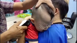 Every parent will relate to this footage of a screaming toddler getting his hair cut