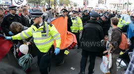 Extinction Rebellion protesters clash with police as tents get dismantled at London's Trafalgar Square