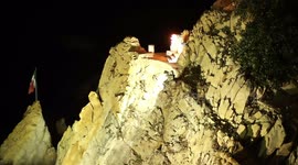 the famous cliff divers in acapulco, mexico at night