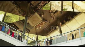 filming the relfection of the encants second hand market in barcelona from the mirrored roof